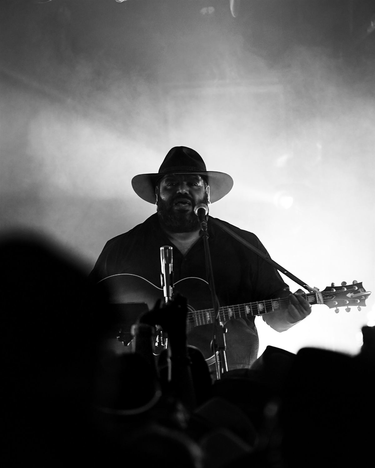 Black and white photo of Bradley singing live